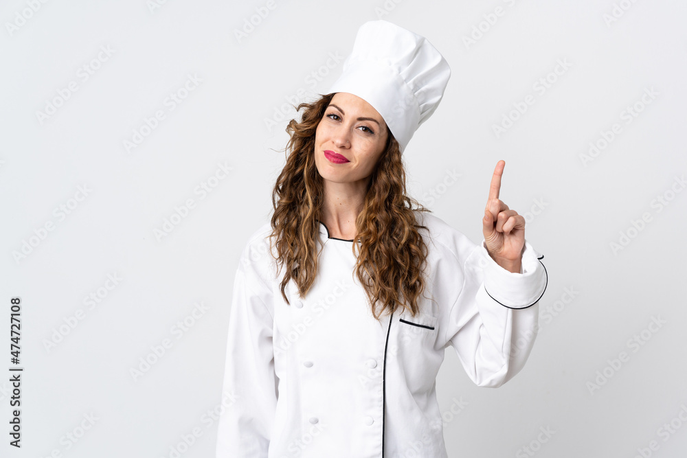 Young chef woman isolated on white background showing and lifting a finger in sign of the best Young chef woman isolated on white background showing and lifting a finger in sign of the best