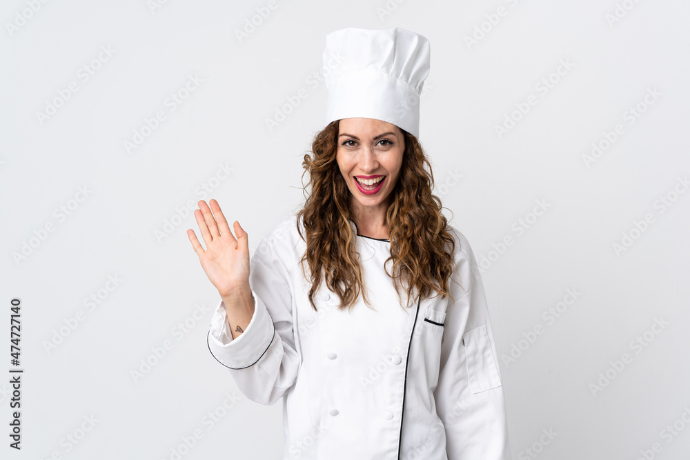 Young chef woman isolated on white background saluting with hand with happy expression Young chef woman isolated on white background saluting with hand with happy expression