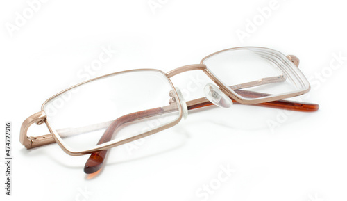 Gold glasses isolated on a white background