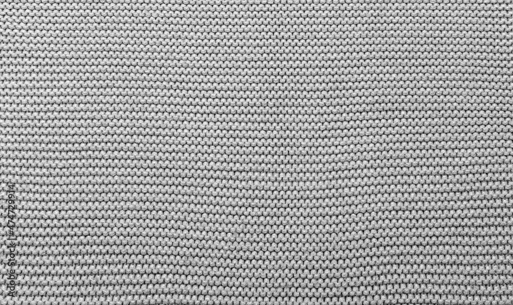 The texture of a beautiful knitted fabric. The pattern is clearly visible. The texture of a beautiful knitted fabric. The pattern is clearly visible.