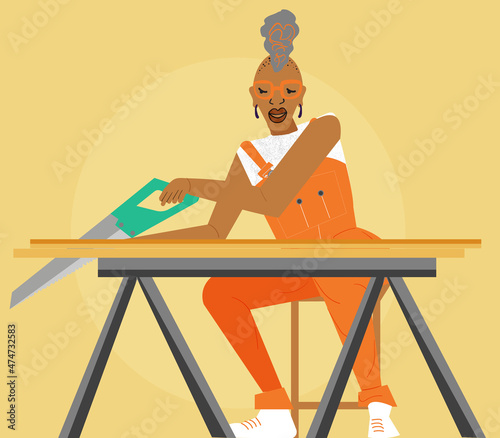 Gay woman carpenter using a wood saw 