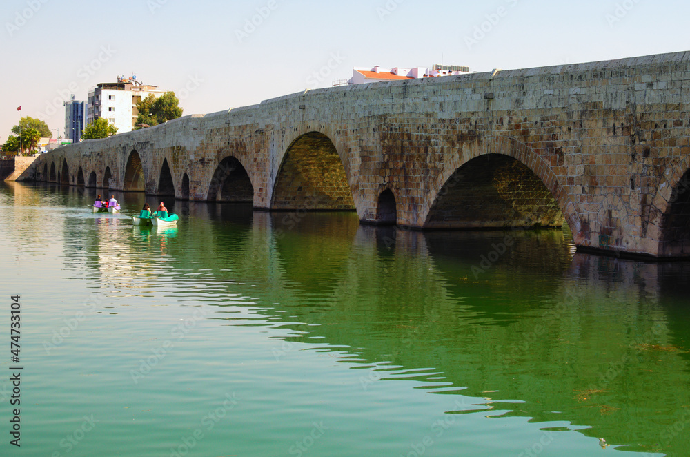 Picturesque landscape view of ancient roman bridge over Seyhan River in Adana. Famous touristic place and travel destination in Adana