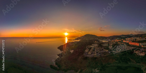 Lever du jour à Port Vendres sur la côte Vermeille,sunrise viewed from drone upon the rocky coast 