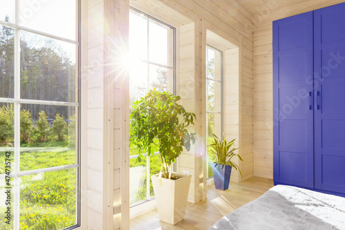 Bright interior  room in wooden house with large window. Scandinavian style.