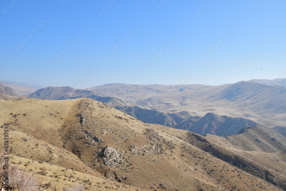 Panoramic views of the mountains. Mountains in the morning fog. The beginning of a sunny day.