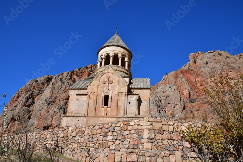 Church in the Naravank monastery. View of the church and high sheer cliffs.