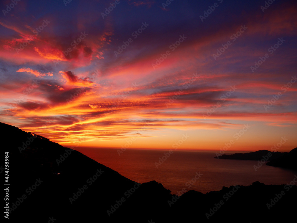 Dramatic sunset at the Calanche de Piana, UNESCO world heritage site. Corsica, France.