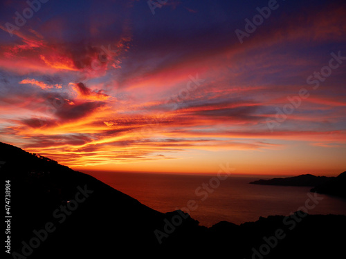 Dramatic sunset at the Calanche de Piana, UNESCO world heritage site. Corsica, France. © Maleo Photography