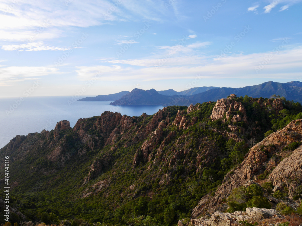Red cliffs at the Calanche de Piana, UNESCO world heritage, at sunset. Corsica, France.