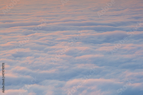 An early morning landscape with the sea of       clouds below and the morning sun rising.