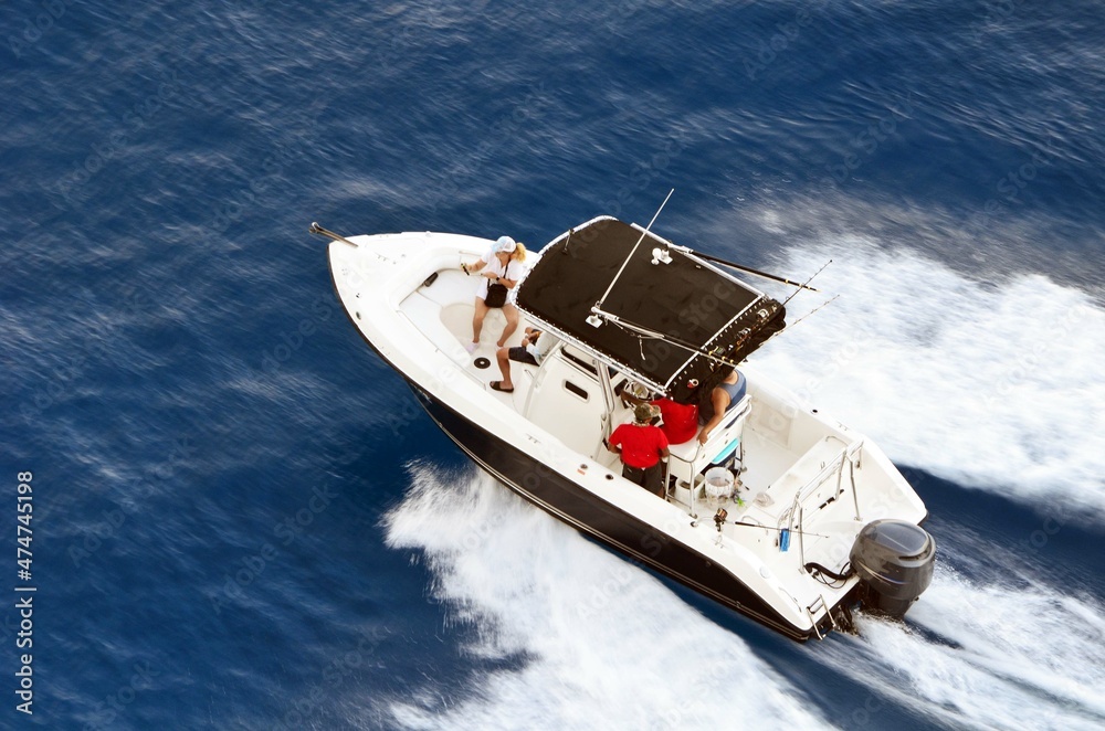 Φωτογραφία Angled overhead view of a sport fishing boat speeding off of the coast of Cozumel,`Mexico