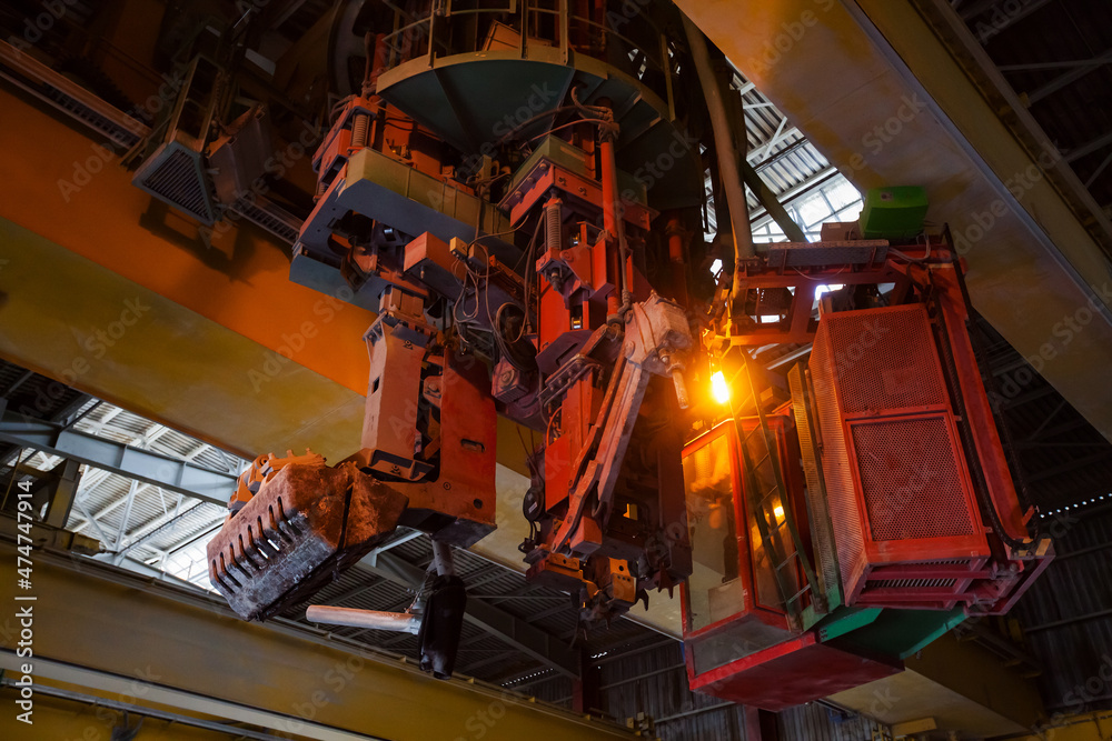 Aluminum electrolysis plant. Slag handling crane machine close-up. Slag bucket.