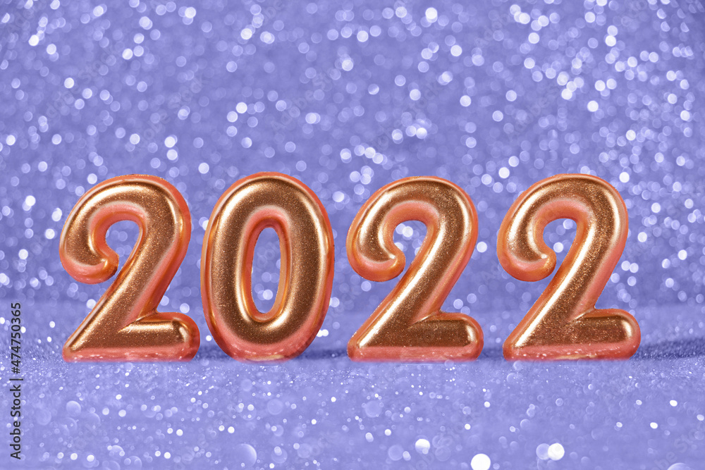 Golden numbers 2022 on the sparkling trendy violet background. Golden numbers 2022 on the sparkling trendy violet background.