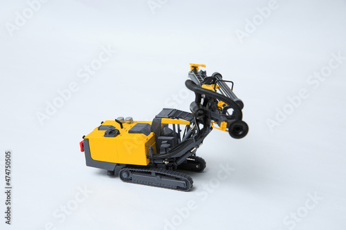 Drilling machine for contour drilling of boreholes for blast preparation in the quarry. The layout of a small quarry drilling rig on a white background.