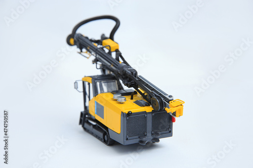 Drilling machine for contour drilling of boreholes for blast preparation in the quarry. The layout of a small quarry drilling rig on a white background.