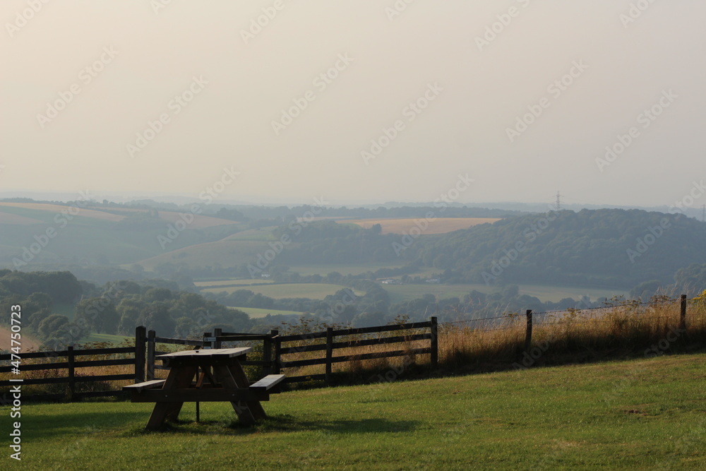 picnic basket with a view. scenic view with fog. 