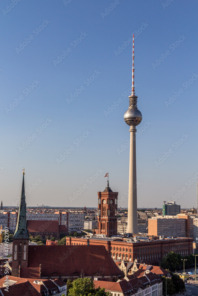 Aerial view of Berlin skyline with famous TV tower at Alexanderplatz and at sunset, Germany