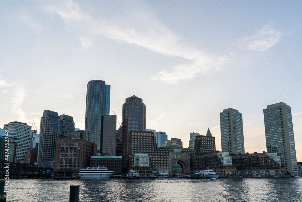 Panoramic picturesque city view of Boston Harbour and Seaport Blvd at afternoon time, Massachusetts. An intellectual, technological and political center. Building exteriors of financial downtown.