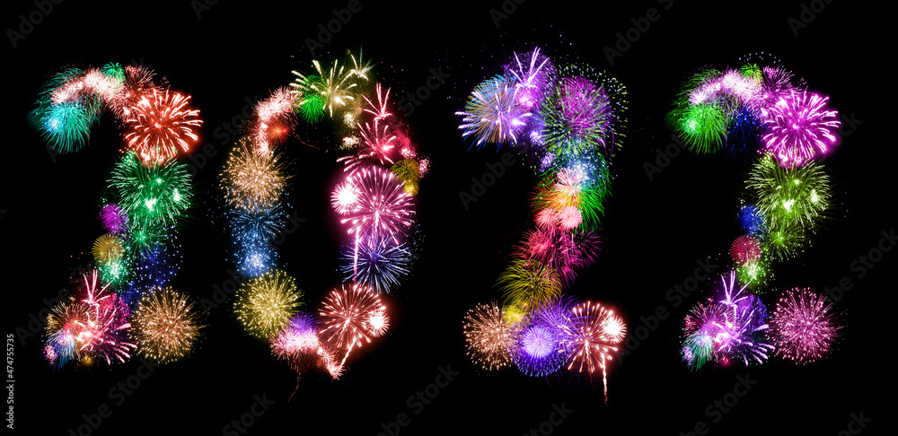 2022 New Year. Two thousand twenty two Happy New Year. Numbers are made of holiday fireworks over the on black