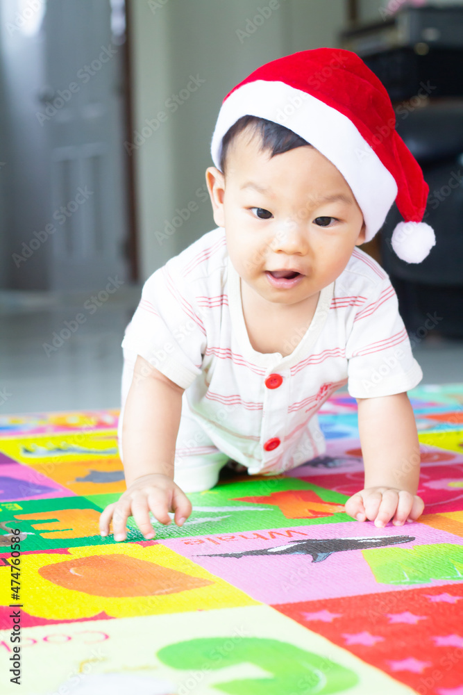 Asian little boy in a Christmas hat Asian little boy in a Christmas hat