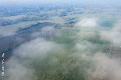 The fog over the countryside in Europe, in France, in the Center region, in the Loiret, towards Orleans, in Winter, during a sunny day. © Florent