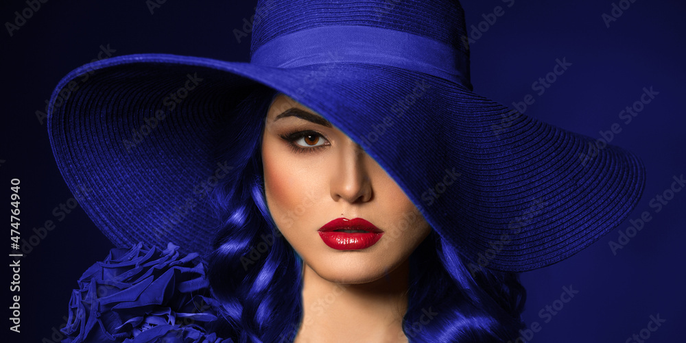 Portrait of a beautiful woman with red lips in a hat, toned in color of the year 2022, very peri. Portrait of a beautiful woman with red lips in a hat, toned in color of the year 2022, very peri.