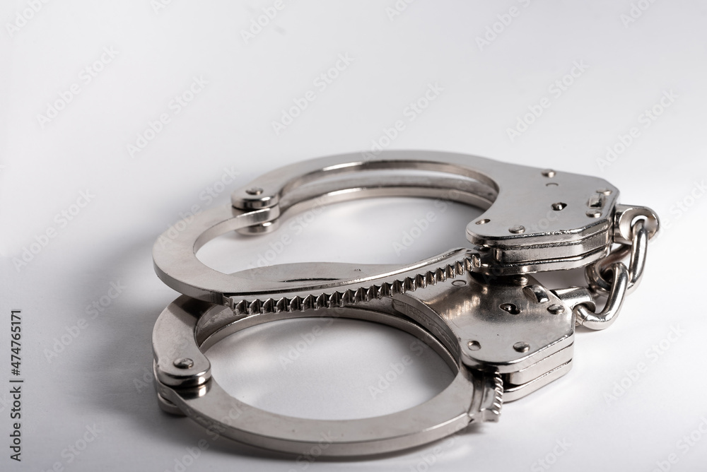 Police handcuffs. A measure of direct coercion. A tool used by the