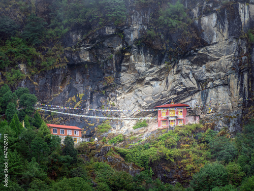 view to mount buddha temple with two buildings in Nepal