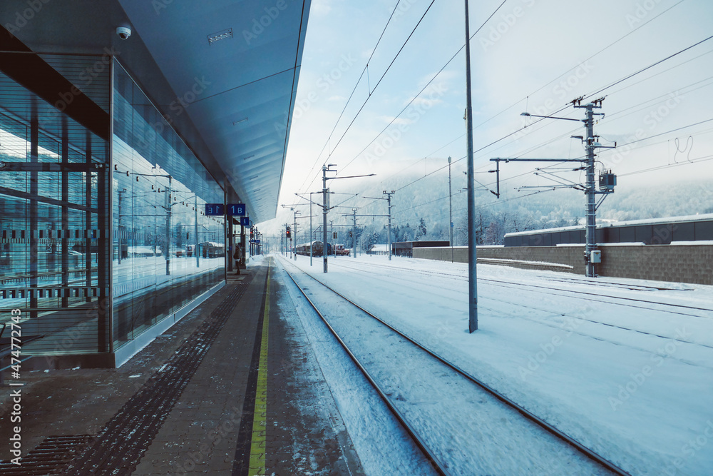 Railway station in winter in the snow. Trains at a beautiful train station in Austria.