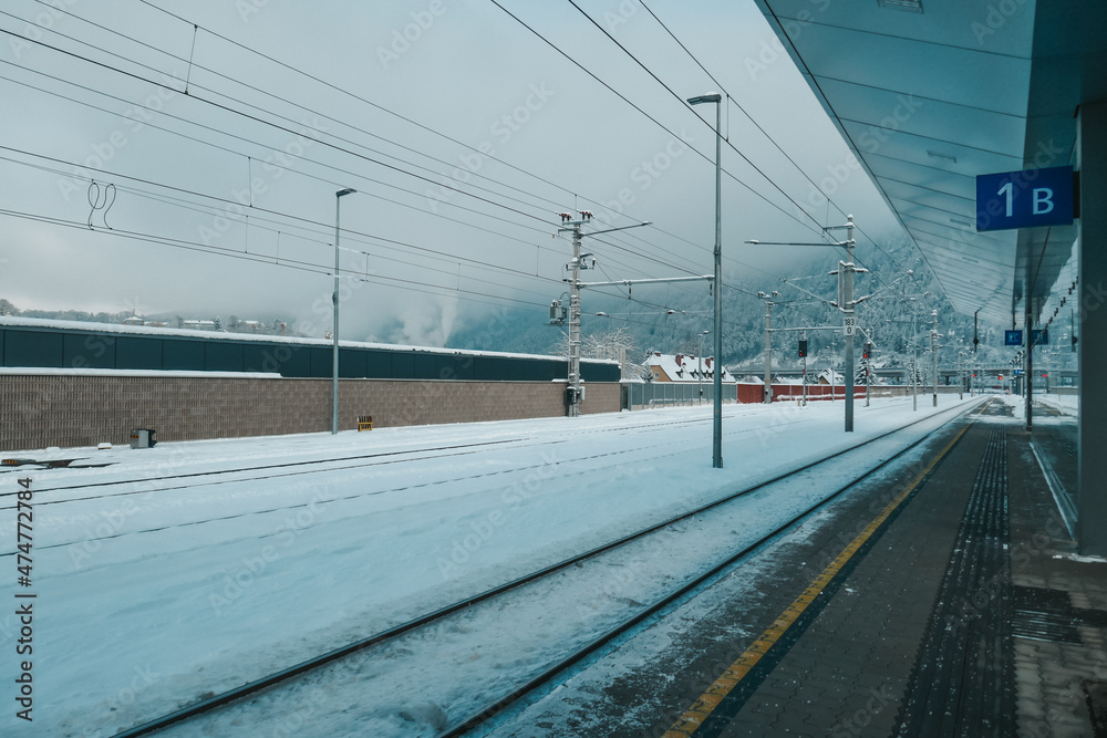 Railway station in winter in the snow. Trains at a beautiful train station in Austria.