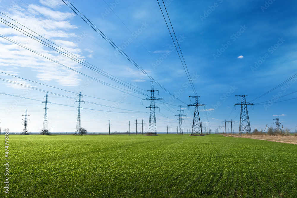 power line summer landscape . passing overhead electricity wire of the support carrying the light and the heat in the house power line summer landscape . passing overhead electricity wire of the support carrying the light and the heat in the house