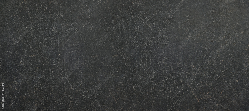 Obraz premium Black or dark gray rough grainy stone texture background