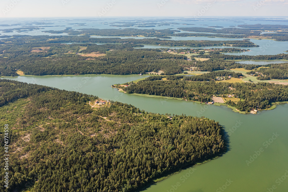 Photo from a drone, on a sunny summer day, a view of the islands in the sea. Finland, Turku. Nature and landscape of Scandinavia