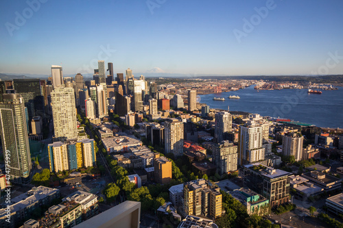 Seattle, Washington, USA - June 4 2021: Seattle downtown skyline and Mount Rainier during summer sunset. View from Seattle needle.