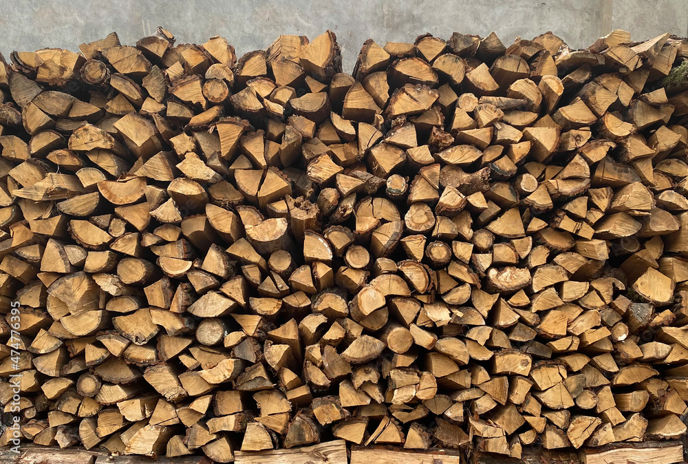Warehouse or stack of firewood for starting a fireplace or heating a house, stock for the winter, source or template