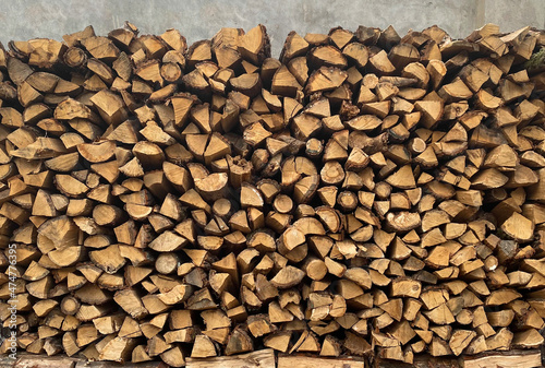Warehouse or stack of firewood for starting a fireplace or heating a house  stock for the winter  source or template