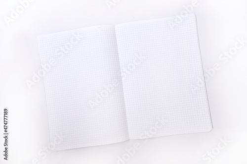 Blank notebook in a cage on a white background, top view