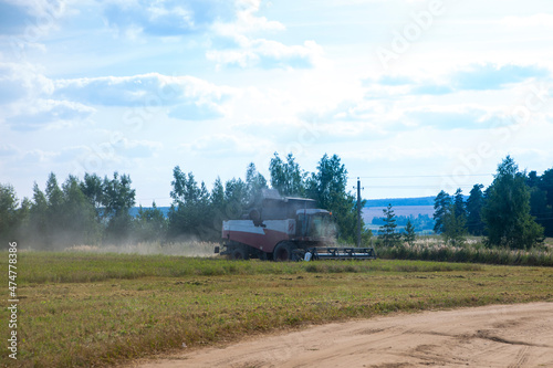 Combine harvester harvesting wheat field crop harvest