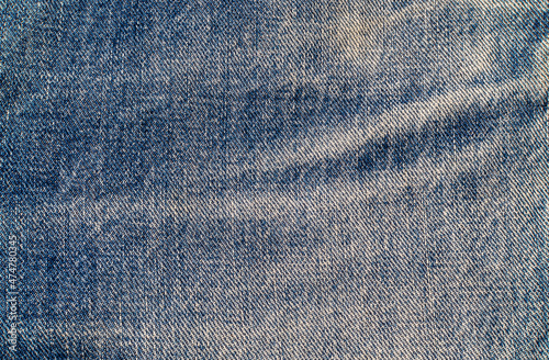 Close up denim texture with frayed areas