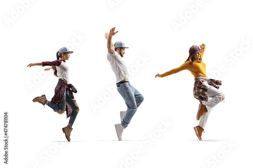 Fototapeta Naklejka Na Ścianę i Meble -  Full length shot of street style dancers performing a choreography
