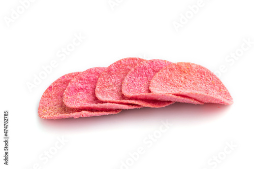 Red potato chips isolated on white background. Side view, close up.