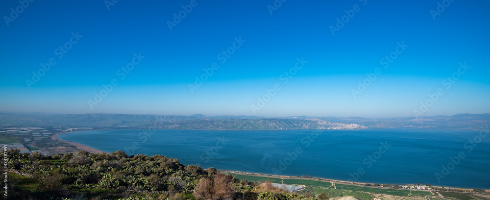 View of the south part of the Sea of Galilee as seen from the Golan heights in Israel. Mount Tabor can also be seen in the distance.