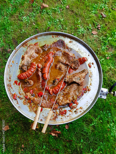 Traditional Croatian dish - kotlovina plate cooking