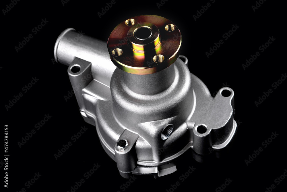 Automotive water pump, pump for pumping the coolant of the truck, part of the car engine cooling system. Black background