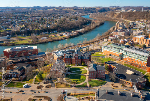 Aerial drone panoramic shot of the downtown campus of WVU in Morgantown West Virginia showing the river in the distance photo