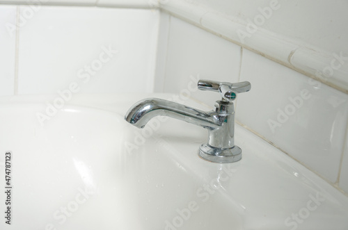 toilet white sink and faucet