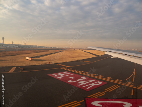 Runway at  Airport in the setting sun