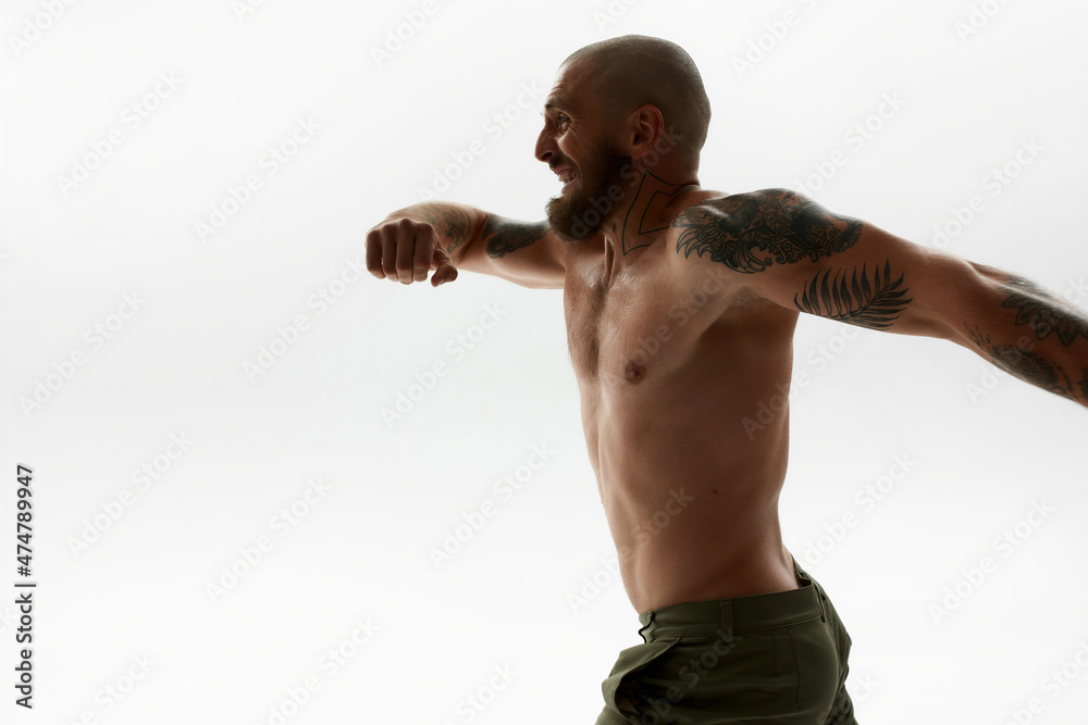 Side view of young bald european man running Side view of young bald european man running