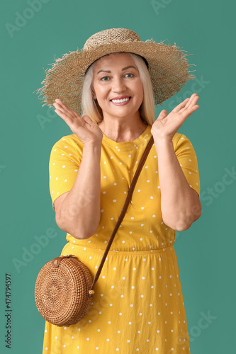 Happy mature woman in straw...