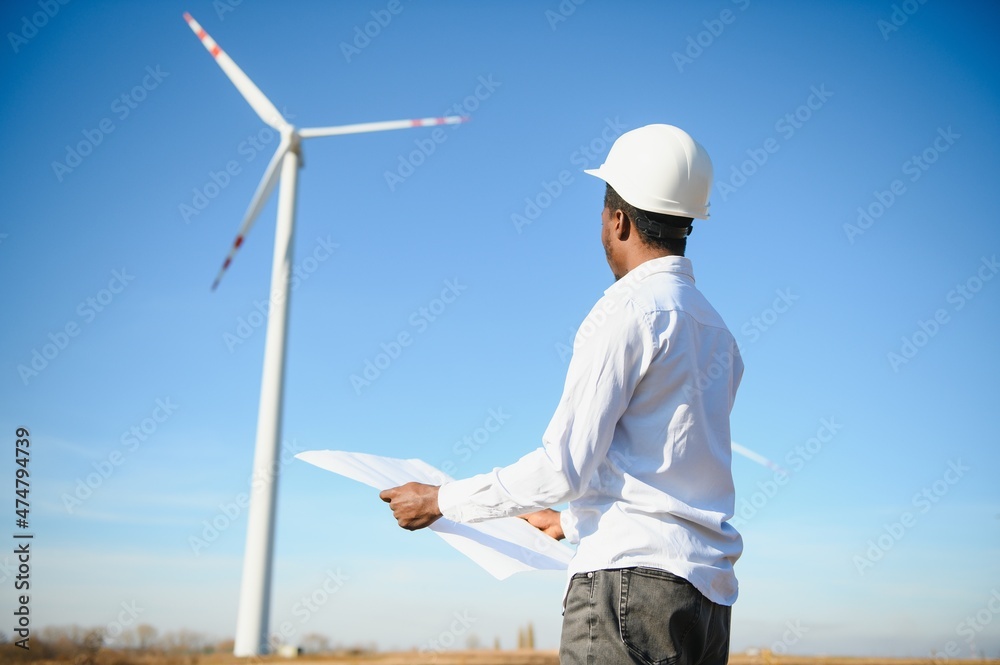 Engineers are investigating the wind turbine. Engineers are investigating the wind turbine.
